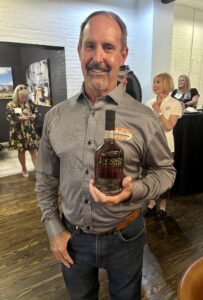 Craig Beam with a bottle of Jackson Purchase bourbon