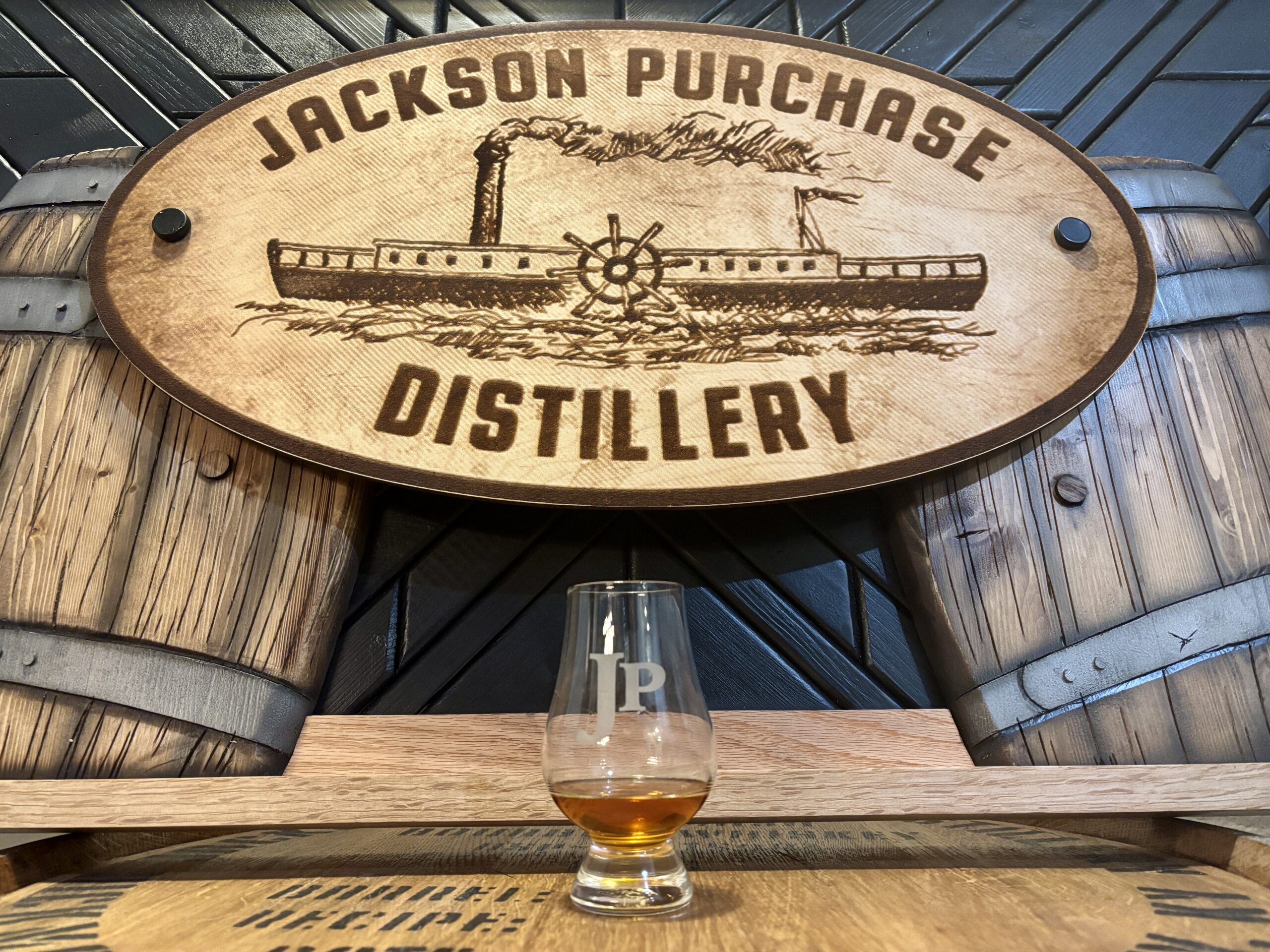 Jackson Purchase bourbon next to logo